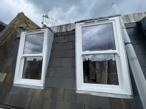 White sash windows fitted in a roof dormer