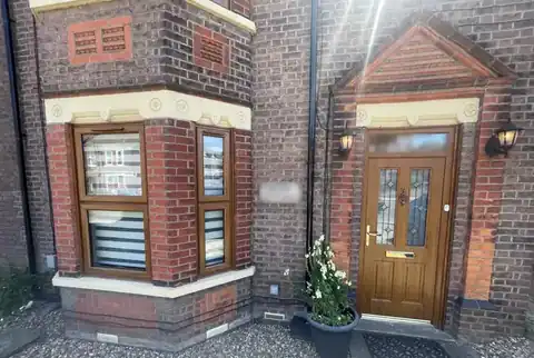 A woodgrain bay window and front door